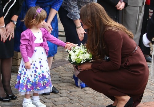 the duchess of cambridge accepts flowers from Lucy Bell
