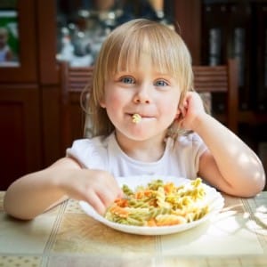 Little girl having a pasta dinner