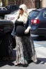 Jessica Simpson shows her growing baby bump as she carries her daughter Maxwell into a lunch date in Los Angeles