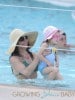Bikini clad Bethenny Frankel relaxes poolside with her daughter Bryn in Miami after facing off with her ex in court