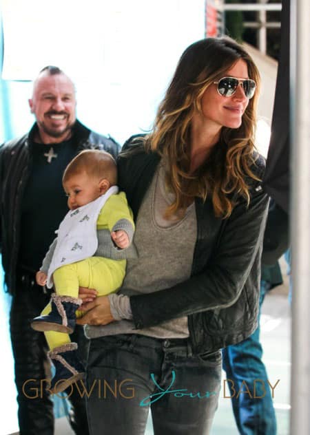 Gisele Bundchen carries her daughter Vivian Lake as she goes apartment shopping in NYC