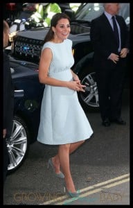 Catherine Duchess of Cambridge shows off her baby bump in a light blue dress at The Art Room charity at the National Portrait Gallery in London