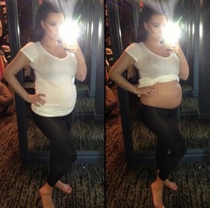 Pregnant Kim Kardashian bares her bump!
