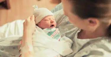 new mom holding her baby in the hospital