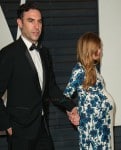 A very pregnant Isla Fisher and husband Sacha Baron Cohen at the 2015 Vanity Fair Oscar Party