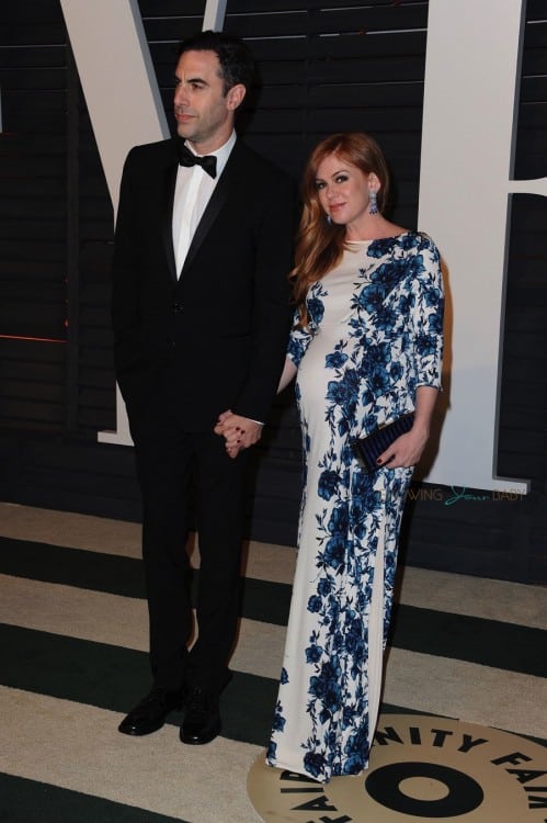 A very pregnant Isla Fisher and husband Sacha Baron Cohen at the 2015 Vanity Fair Oscar Party