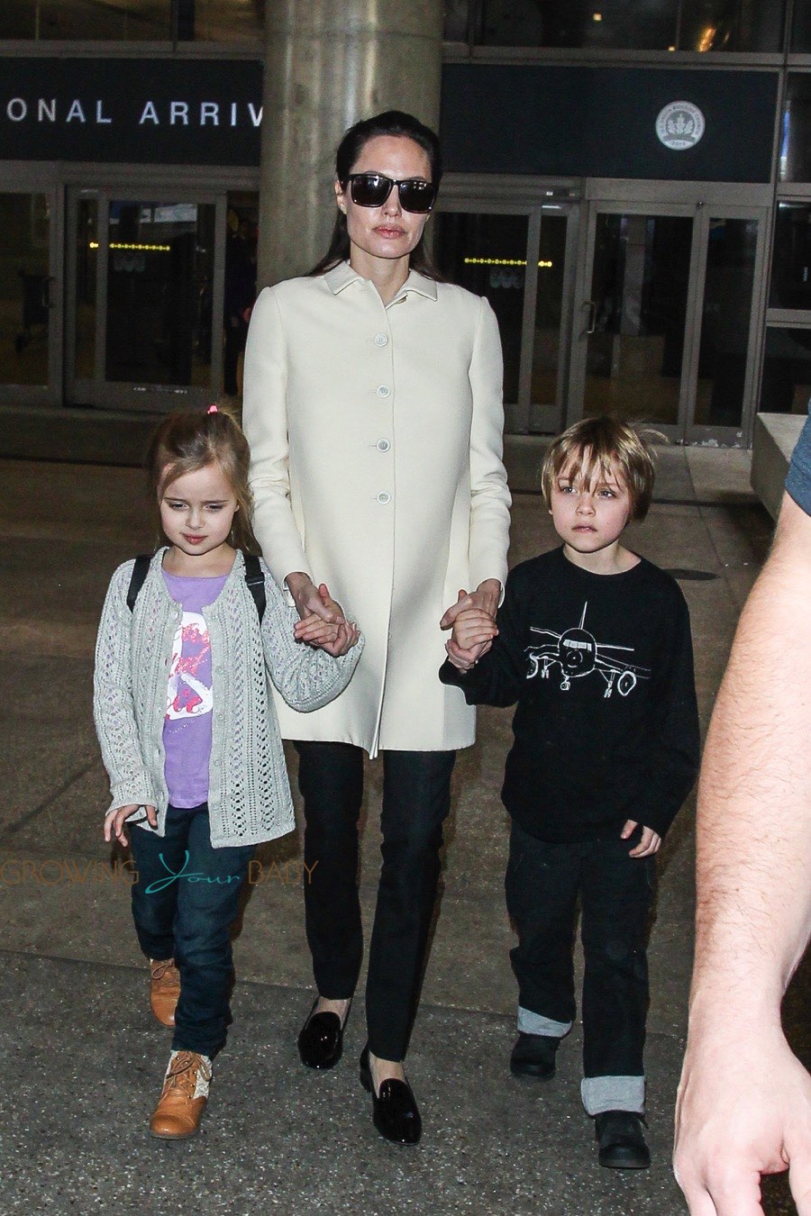Angelina Jolie at LAX with twins Vivienne and Knox - Growing Your Baby