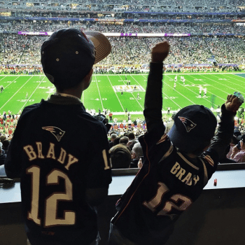 John and Ben Brady cheer their dad on at the Superbowl