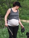 A Very Pregnant Milla Jovovich Hikes The Hills With Her Pups