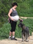 A Very Pregnant Milla Jovovich Hikes The Hills With Her Pups