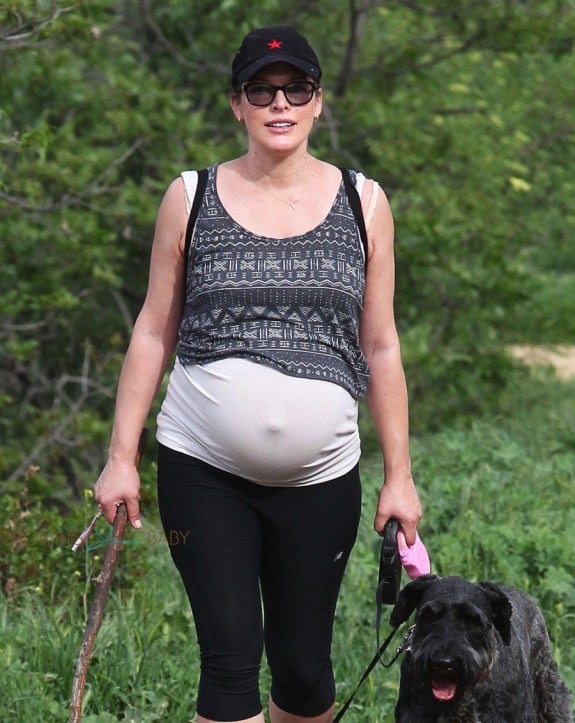 A Very Pregnant Milla Jovovich Hikes The Hills With Her Pups