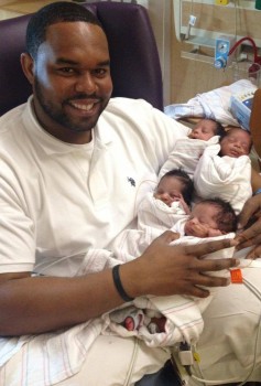 Carlos Morales with his quadruplets