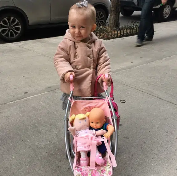 Carmen Baldwin pushing her Baby Anabelle stroller with baby dolls