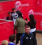 David and Victoria Beckham take their boy's picture at Romeo's mini London Marathon