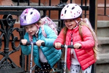 Tabitha and Marion Broderick scoot to school