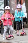Tabitha and Marion Broderick scoot to school