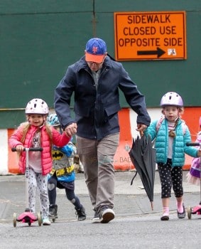 Tabitha and Marion Broderick scoot to school with their dad Matthew