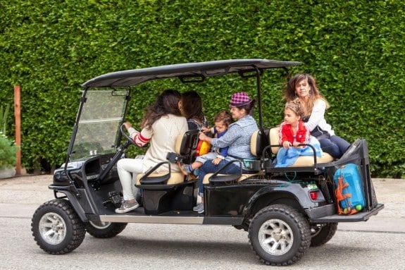 Camila Alves shuttles her kids Vida and Livingston from a birthday party in a golf cart