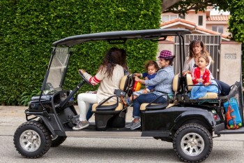 Camila Alves shuttles her kids Vida and Livingston from a birthday party in a golf cart