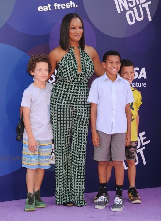 Garcelle Beauvais attends Inside Out Premiere with her sons Jax and Jaid