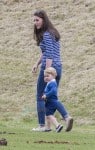 Prince George watches with The Duchess of Cambridge as Prince William plays polo with Prince Harry