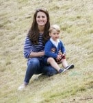 Prince George watches with The Duchess of Cambridge as Prince William plays polo with Prince Harry