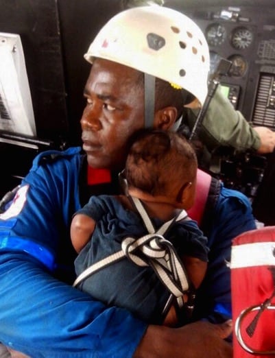 A member of the Red Cross carries Yudier Moreno. Photograph: Colombian Air Force/EPA 