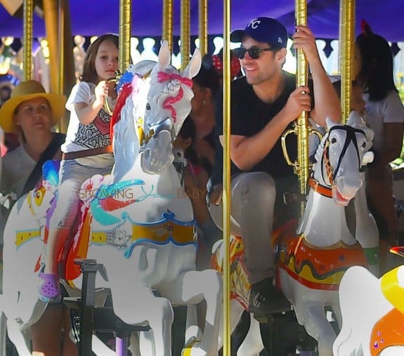 Paul Rudd and his daughter Darby enjoy a ride at King Arthur Carrousel, Anaheim