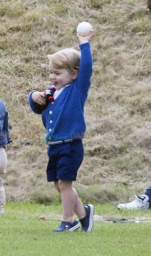 Prince George watches with The Duchess of Cambridge as Prince William plays polo with Prince Harry