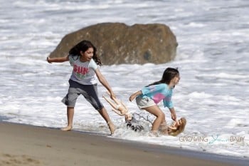 Sunny and Sadie Sandler at the beach with their parents for Father's Day