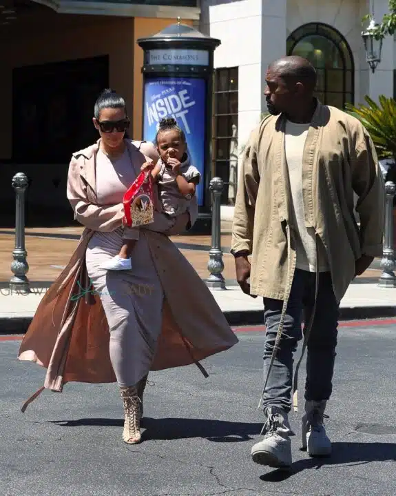 Kim Kardashian and Kanye West with daughter North leaving the movies