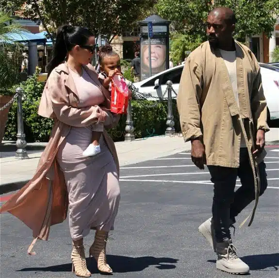 Kim Kardashian and Kanye West with daughter North leaving the movies