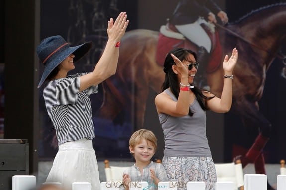 Marion Cotillard and her son Marcel cheer for her husband Marcel Canet during  Longines Global Champions Tour