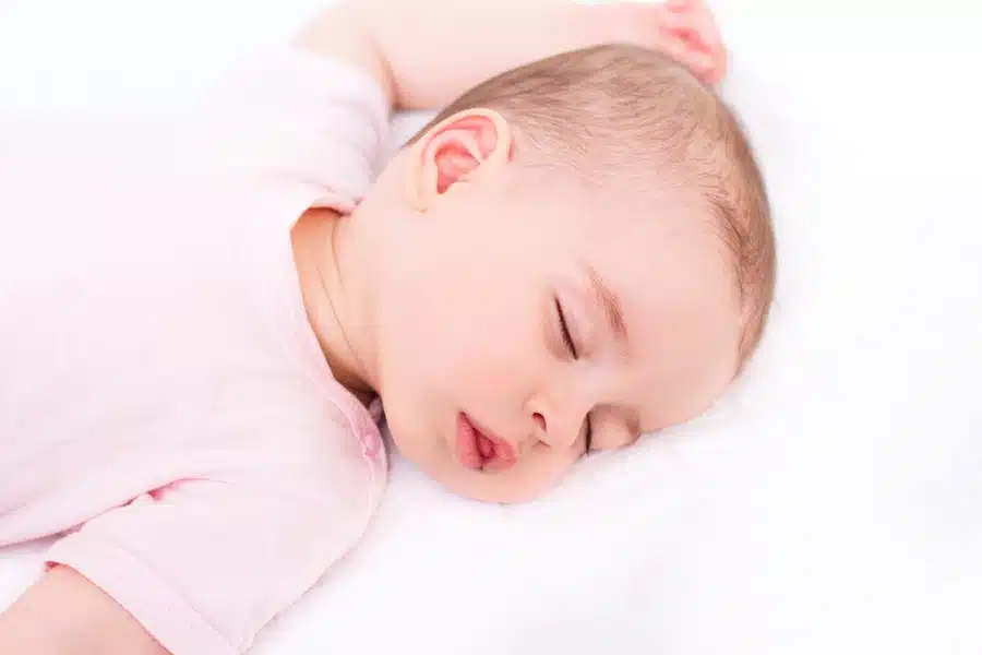 baby sleeping on her back