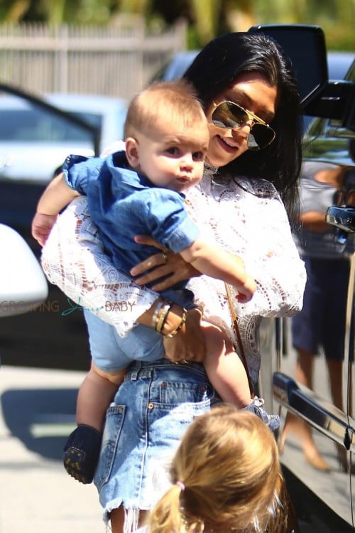 Kourtney Kardashian out at a birthday party with daughter Penelope and son Reign Disick