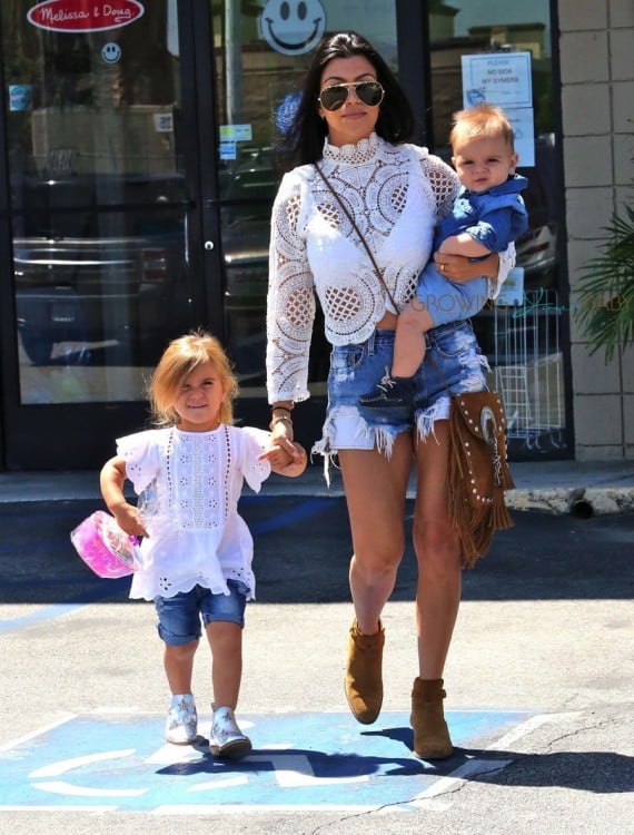 Kourtney Kardashian out at a birthday party with daughter Penelope and son Reign Disick
