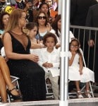 Mariah Carey sits with her twins Moroccan and Monroe Cannon at Hollywood Walk Of Fame Star Ceremony