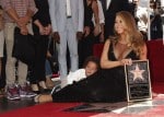 Moroccan Cannon holds on to his mom Mariah Carey at her Hollywood Walk of Fame Ceremony
