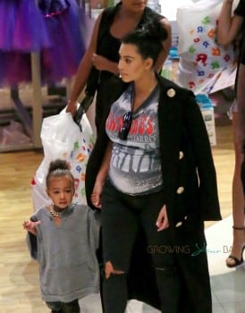 Pregnant Kim Kardashian at Toys R US with daughter North West