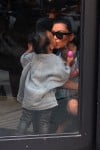 Pregnant Kim Kardashian kisses daughter North West at Toys R US