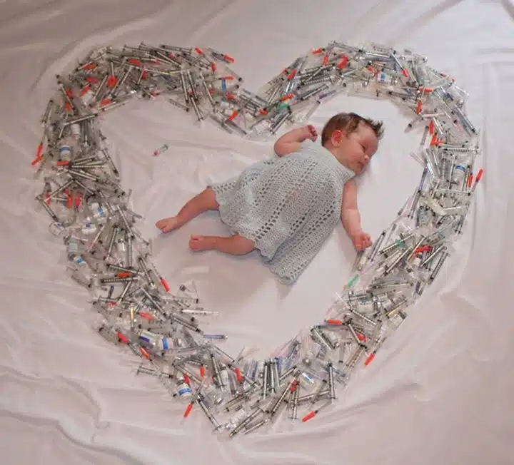Mom Shares Image of Baby surrounded by Syringes To Create Awareness About Infertility