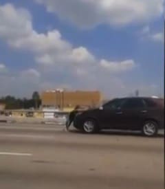 Motorists Film Video Of Pregnant Woman Clings to Car Driving on Freeway