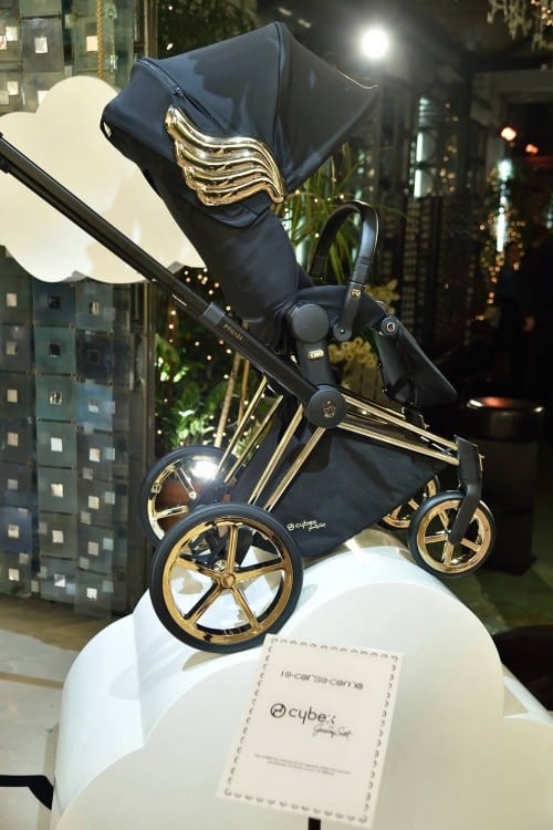 black pram with gold wings