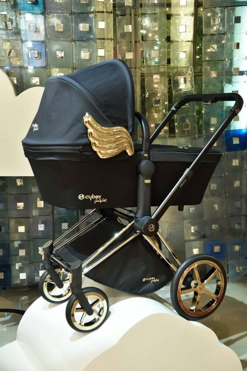 black pram with gold wings