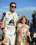 Jeff Gordon, driver of the #24 AXALTA Chevrolet, walks on the track with his daughter Ella Gordon prior to the start of the NASCAR Sprint Cup Series Ford EcoBoost 400 at Homestead-Miami Speedway