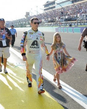 Jeff Gordon, driver of the #24 AXALTA Chevrolet, walks on the track with his daughter Ella prior to the start of the NASCAR Sprint Cup Series Ford EcoBoost 400 at Homestead-Miami Speedway