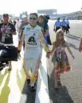 Jeff Gordon, driver of the #24 AXALTA Chevrolet, walks on the track with his daughter Ella prior to the start of the NASCAR Sprint Cup Series Ford EcoBoost 400 at Homestead-Miami Speedway