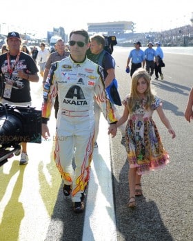 Jeff Gordon, driver of the #24 AXALTA Chevrolet, walks on the track with his daughter Ella prior to the start of the NASCAR Sprint Cup Series Ford EcoBoost 400 at Homestead-Miami Speedway