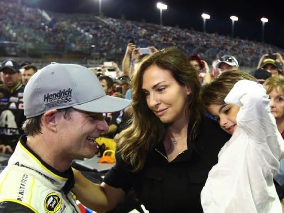 Jeff Gordon greets wife Ingrid Vandebosch and son Leo after the Ford EcoBoost 400