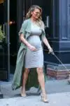 Pregnant Chrissy Teigen steps out with her dog in NYC